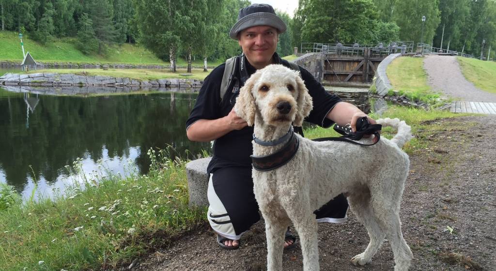 Tomi Pohto and his dog. Saimaa canal is in the background.
